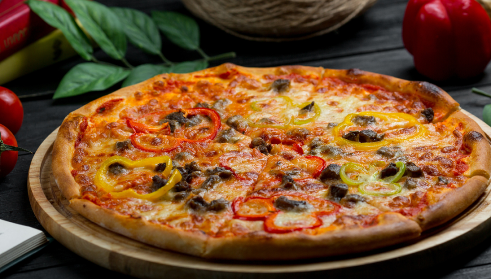 Close-up of a freshly baked Pickle Pie Pizza with melted cheese and sliced pickles on a crispy crust